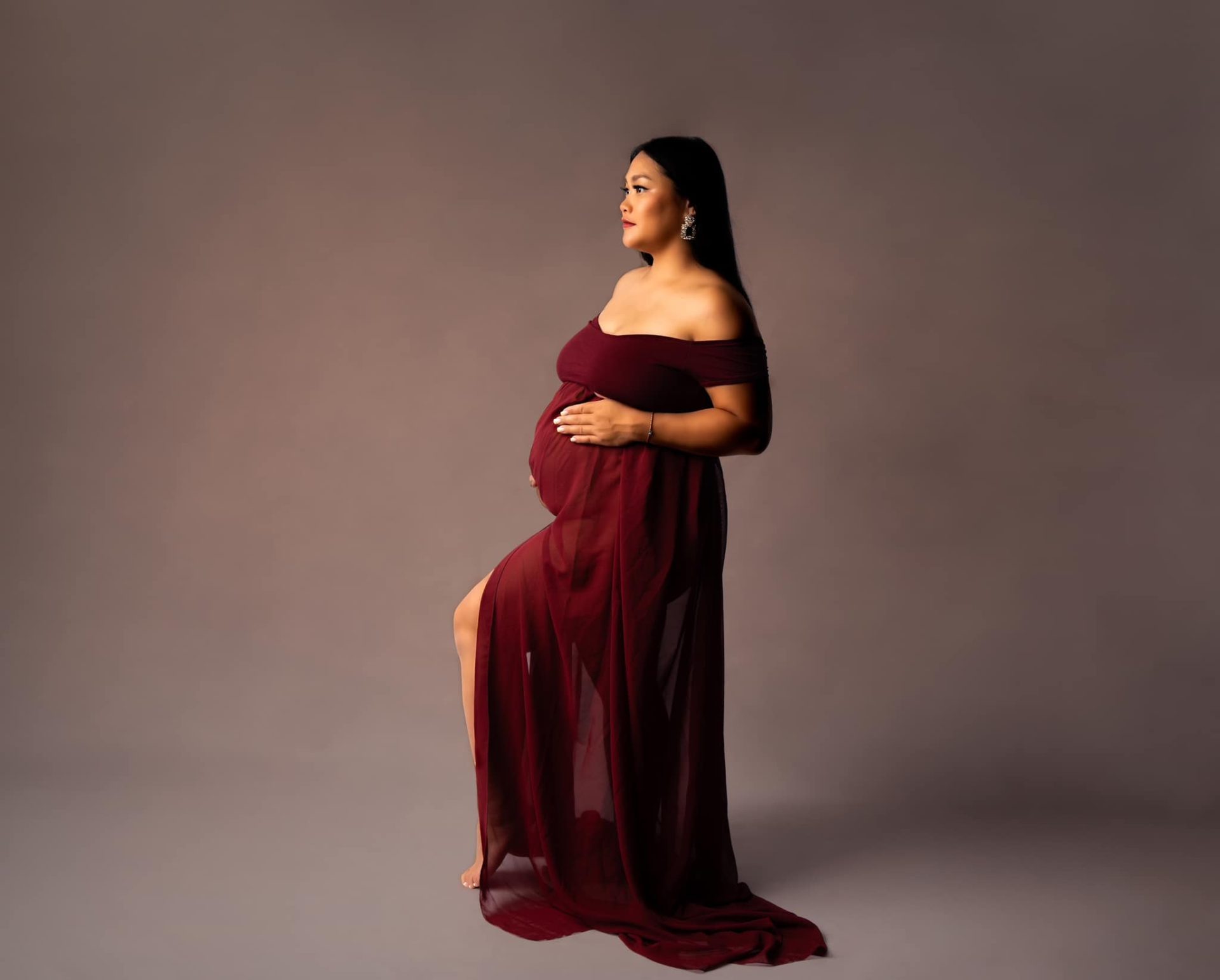 Séance photo femme enceinte robe rouge créateur