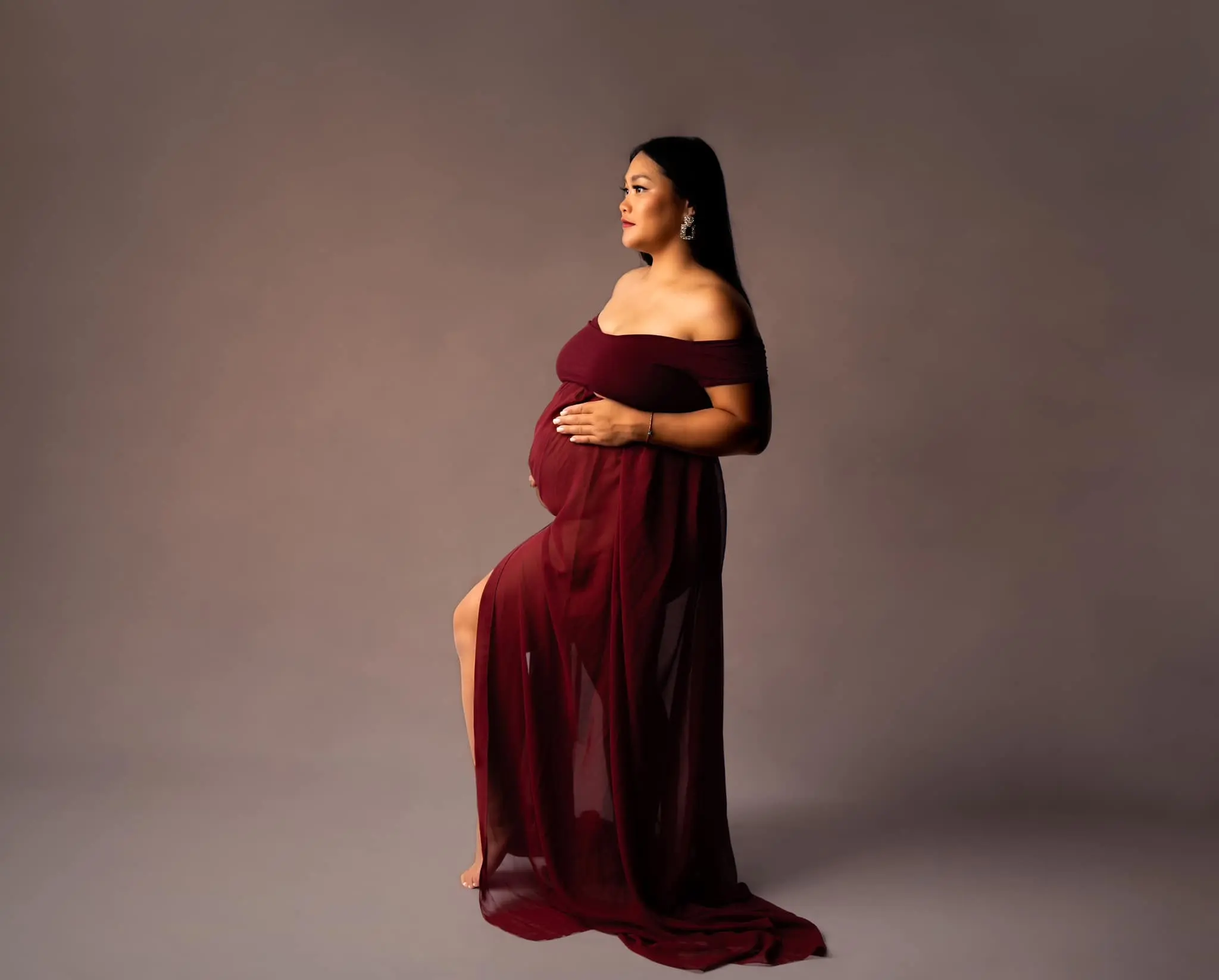 Séance photo femme enceinte robe rouge créateur